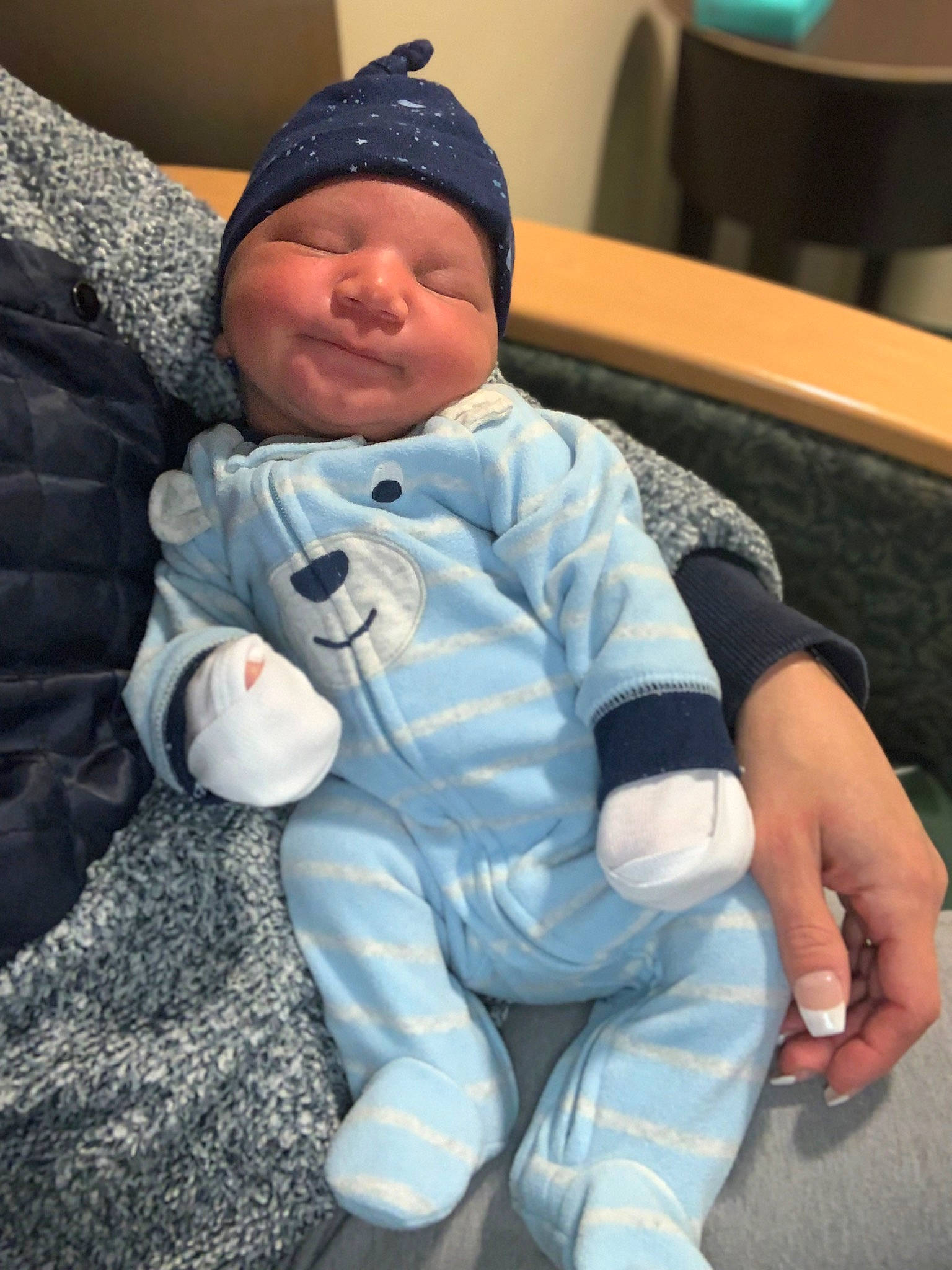 Dallas joined the competition — help win amazing prizes! baby, baby_toddler_clothing, baseball_cap, beanie, cap, cheek, child, comfort, electric_blue, face, fun, fur, headwear, lap, outerwear, person, sitting, skin, smile, thumb