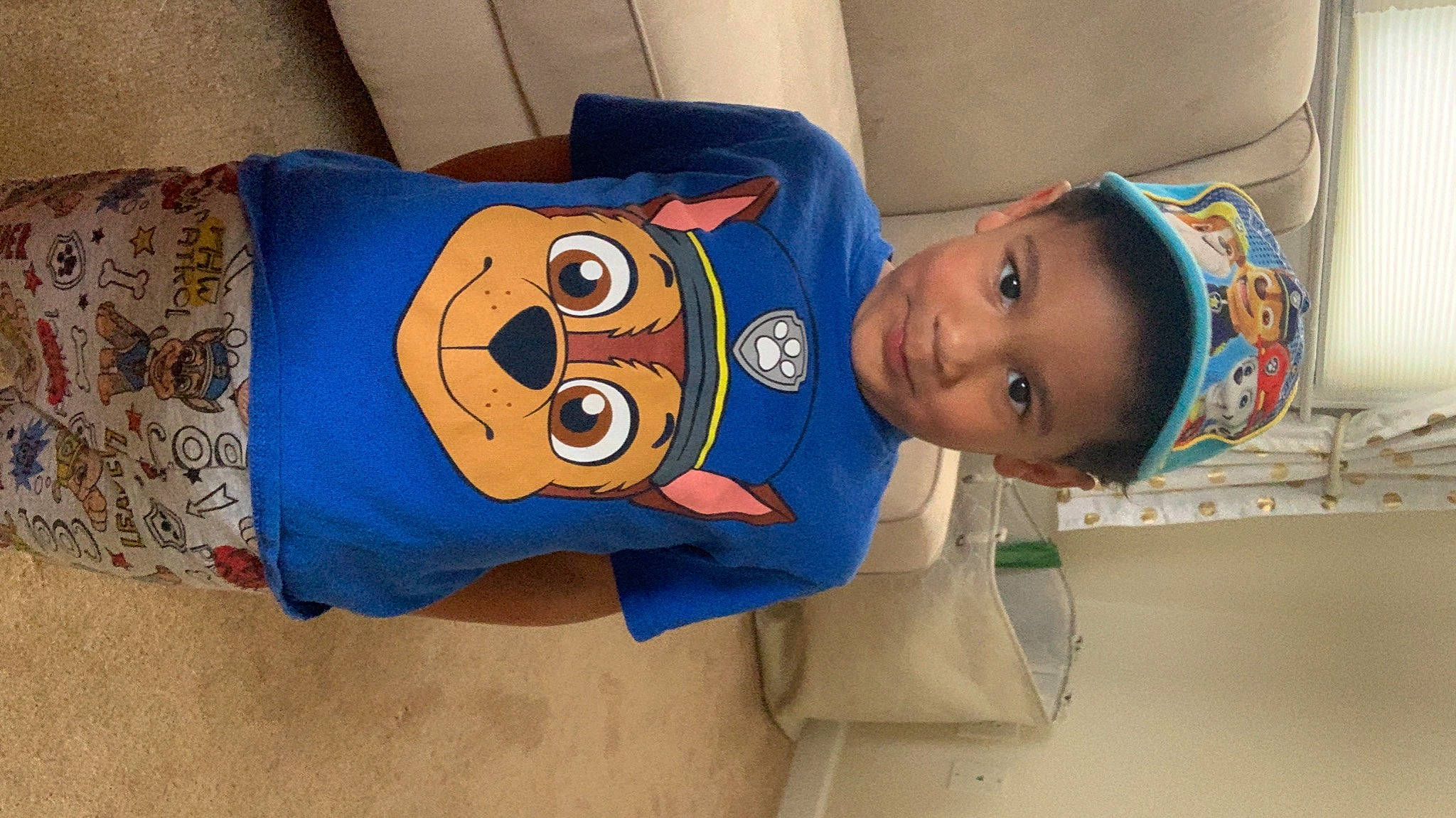 Boston is registered to the contest to win money with this photo: baby, baby_toddler_clothing, child, comfort, elbow, electric_blue, eye, face, fun, happy, hat, head, headgear, joy, linens, mouth, person, room, sleeve, smile