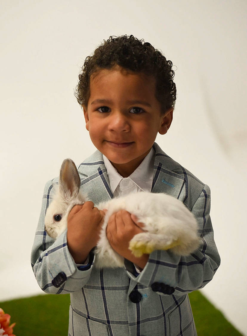 Boston joined the competition — help win amazing prizes! afro, child, clothing, companion_dog, formal_wear, fun, fur, gesture, grass, guinea_pig, happy, jheri_curl, joy, outerwear, people, people_in_nature, person, smile, stuffed_toy, thumb