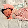 Riley joined the competition — help win amazing prizes! newborn, baby, sleeping, infant, portrait, close_up, face, indoors, blanket, pink_blanket, baby_seat, cushion, clothing, gray_clothing, pastel_colors, cozy, peaceful, resting, nursery, photography