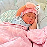 Riley is registered to the contest to win money with this photo: newborn, baby, sleeping, infant, portrait, pink_blanket, baby_hat, princess_hat, crib, baby_seat, swaddled, peaceful, indoors, cozy, resting, face, closed_eyes, clothing, nursery, photography