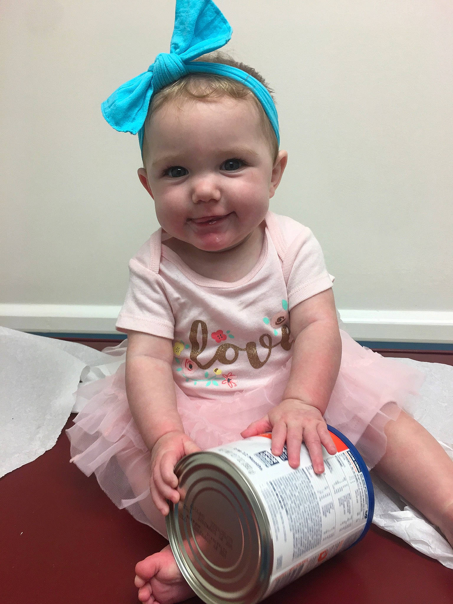Melia joined the competition — help win amazing prizes! baby, baby_toddler_clothing, blue, cap, child, costume_hat, design, drinkware, gadget, happy, head, joy, person, pink, product, room, sleeve, smile, t_shirt, textile