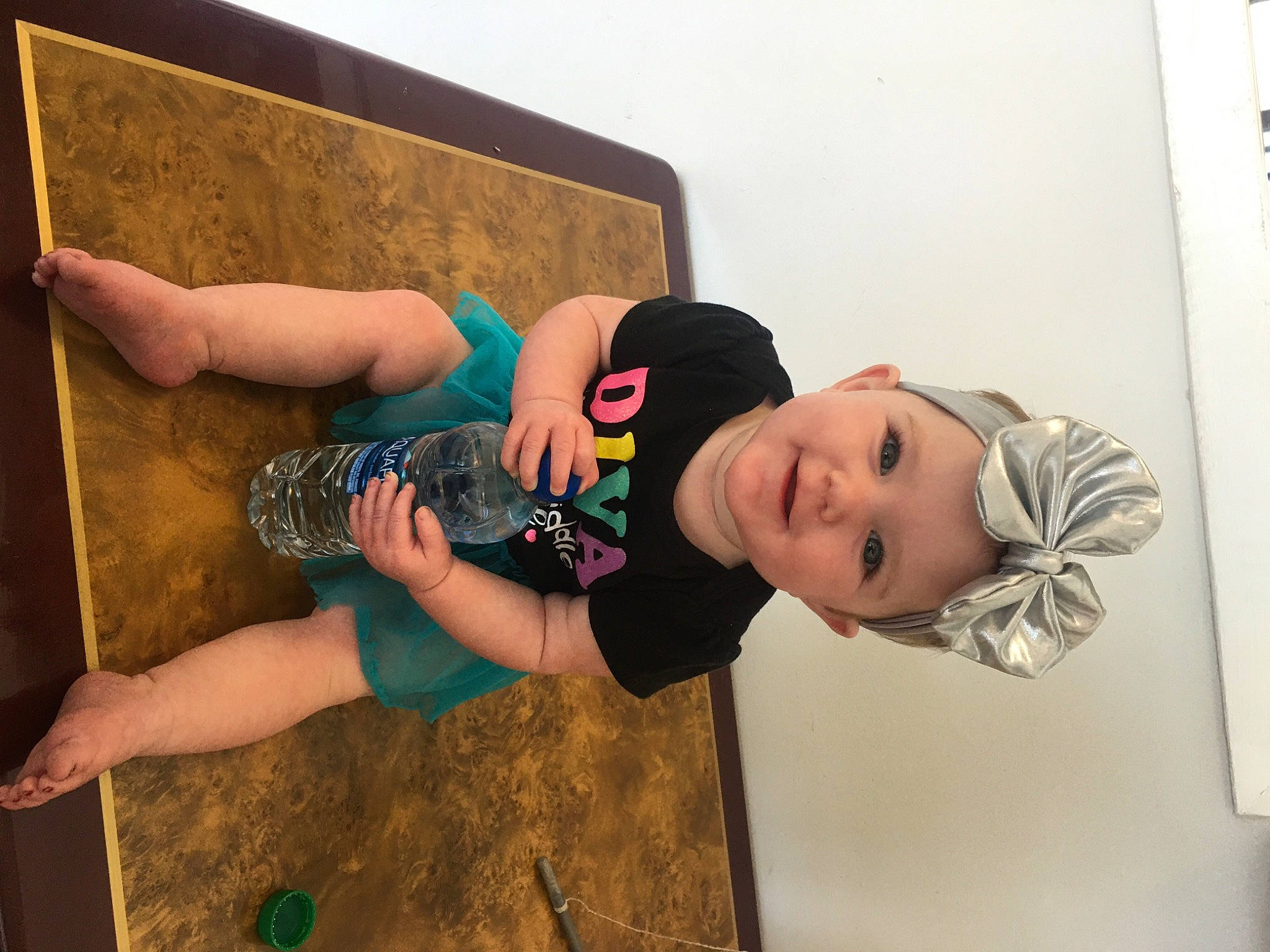 Melia is registered to the contest to win money with this photo: art, baby, baby_toddler_clothing, child, flash_photography, flooring, fun, happy, headwear, human_leg, joint, joy, leisure, person, personal_protective_equipment, room, sandal, smile, t_shirt, thigh