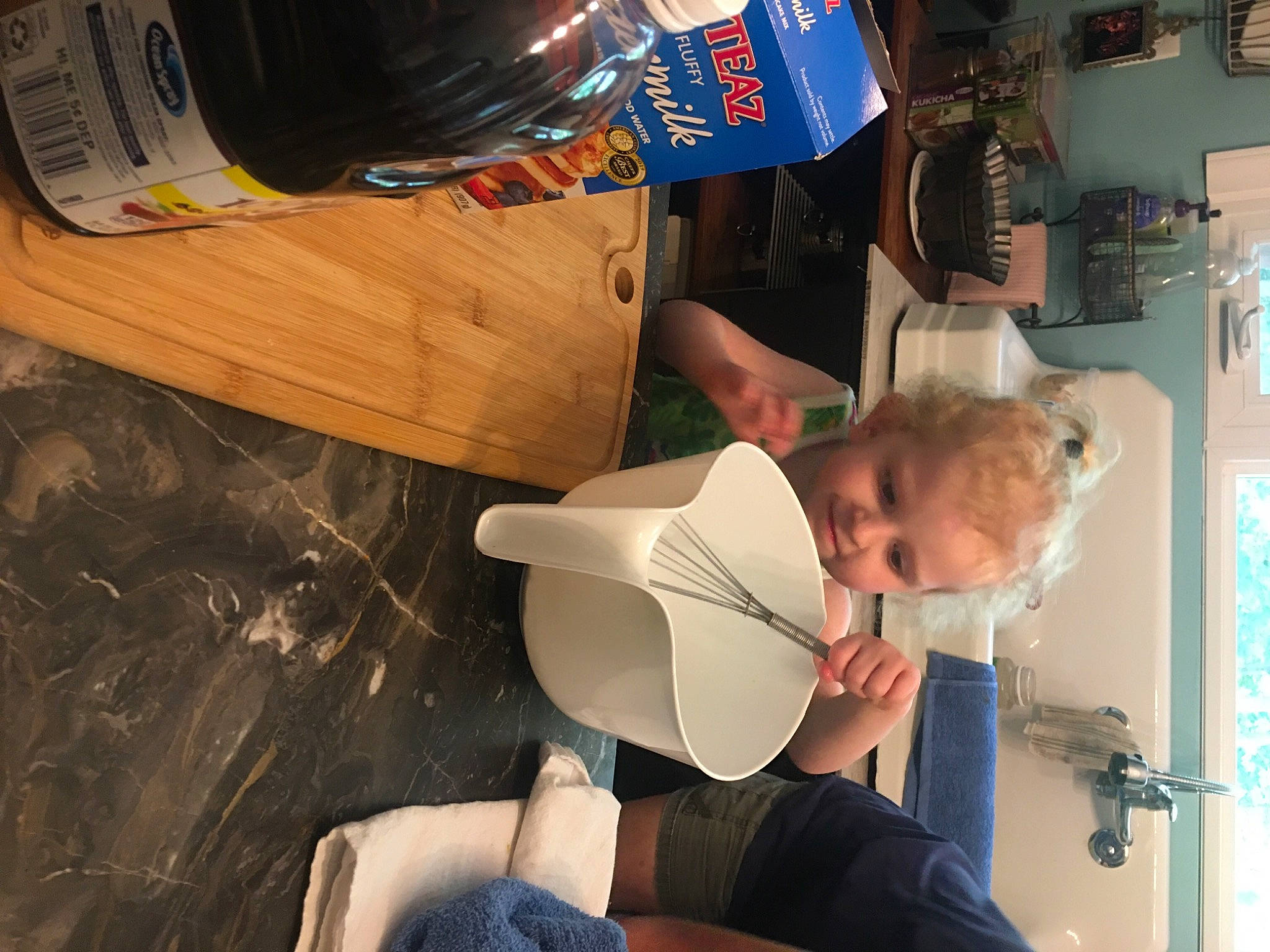 Isabella is registered to the contest to win money with this photo: child, elbow, fun, hat, human_leg, knee, leisure, machine, person, room, space, t_shirt, thigh, toddler, varnish, wood
