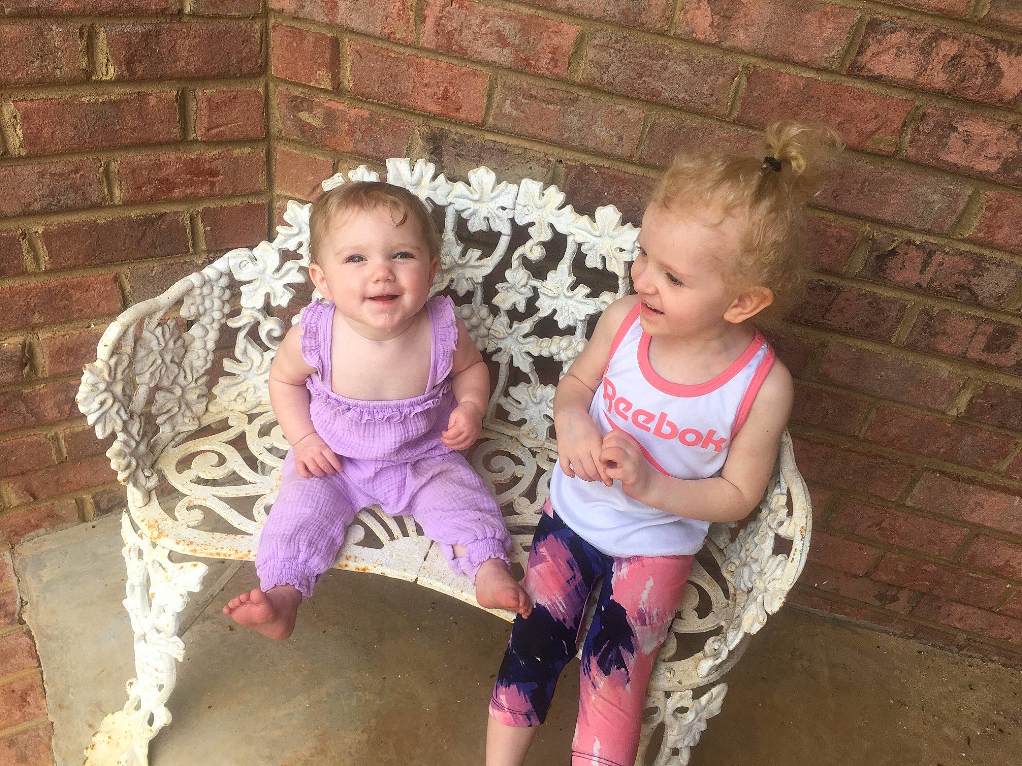 Isabella joined the competition — help win amazing prizes! baby, baby_toddler_clothing, brick, brickwork, chair, child, event, face, fun, grass, happy, human_body, joy, leg, leisure, people, person, pink, sitting, smile