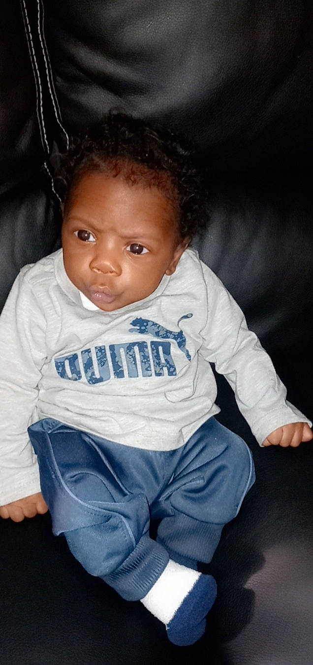 Aquil Randolph is registered to the contest to win money with this photo: baby_toddler_clothing, cheek, chin, eye, eyelash, face, flash_photography, gesture, hair, hairstyle, happy, head, iris, lip, mouth, nose, person, skin, sleeve, smile