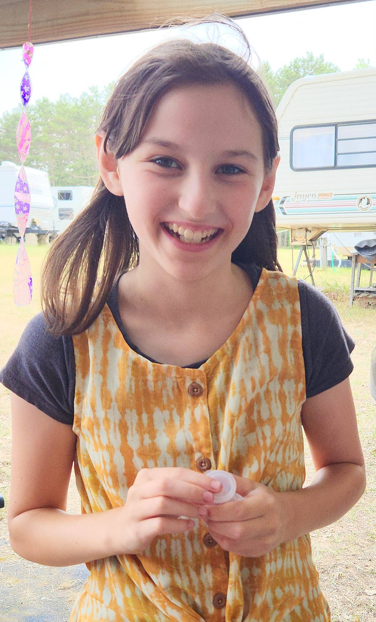Avalon Rae is registered to the contest to win money with this photo: brown_hair, chair, child, event, fun, grass, happy, jewellery, joy, leisure, long_hair, pattern, peach, person, recreation, sitting, skin, sleeve, smile, summer