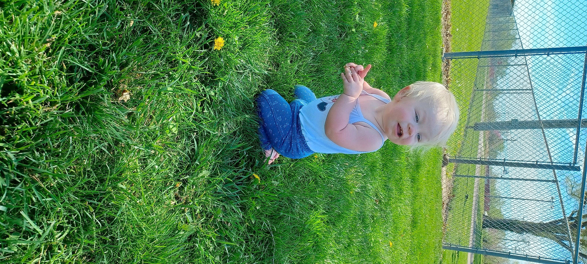 Madalyn joined the competition — help win amazing prizes! baby_toddler_clothing, chair, dress, electric_blue, fun, grass, grass_family, grassland, green, groundcover, happy, human_body, lawn, leg, leisure, meadow, people_in_nature, person, plant, toddler