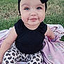 Delilah is registered to the contest to win money with this photo: baby, child, smiling, outdoor, grass, blanket, headband, black_clothing, leopard_print, leggings, socks, cute, portrait, young_child, nature, garden, greenery, sitting, happy, infant