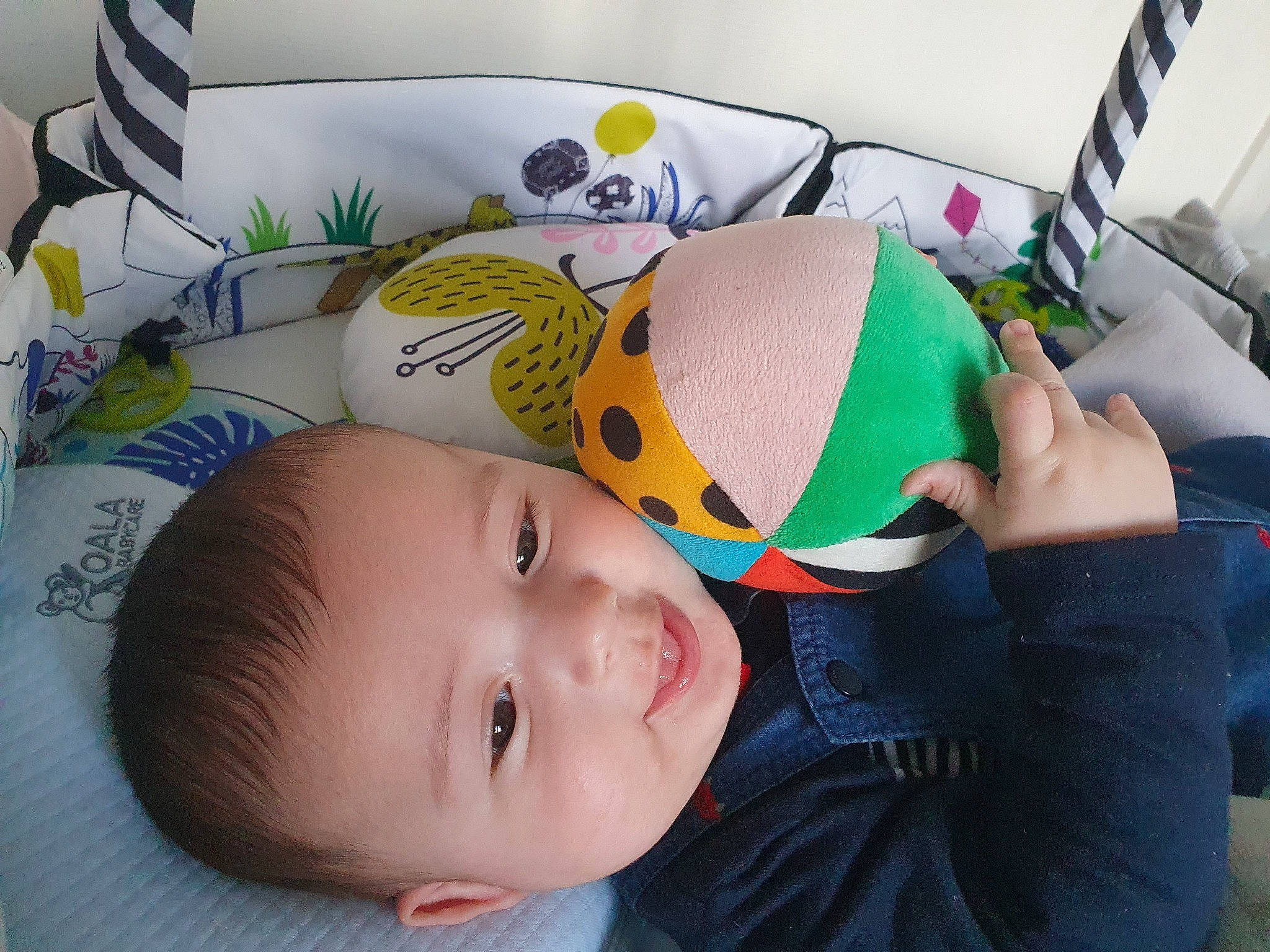 Eyden participe au concours pour gagner de l'argent avec cette photo : art, baby, baby_products, baby_toddler_clothing, bedding, bedtime, chair, cheek, child, comfort, fun, happy, headgear, linens, pattern, person, pillow, room, smile, stuffed_toy