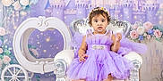 Angelie joined the competition — help win amazing prizes! toddler, child, purple_dress, princess, chair, castle, flowers, carriage, fairy_tale, portrait, indoor, decorations, sparkles, costume, crown, smile, baby, fantasy, photography, cute