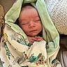 Robin participe au concours pour gagner de l'argent avec cette photo : baby, blanket, child, comfort, cozy, cute, face, hands, head, indoors, infant, newborn, patterned_blanket, peaceful, portrait, resting, sleeping, soft_texture, warm, wrapped