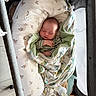 baby, baby_lounger, bedroom, blanket, bottle, child, cozy, cute, fabric, indoor, infant, newborn, pacifier, peaceful, person, playpen, resting, sleeping, soft_toys, wrapped