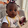 toddler, child, high_chair, bib, pacifier, food, messy_face, hair_ties, pointing, indoor, curtain, baby, clothing, person, cute, expression, seat, feeding, toy, mickey_mouse