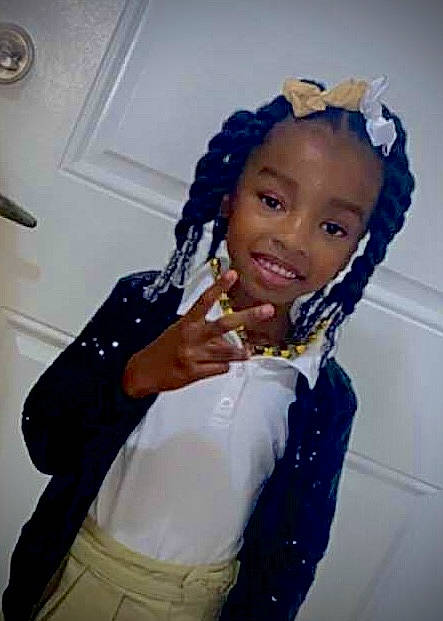 Ariana is registered to the contest to win money with this photo: abdomen, arm, baby_toddler_clothing, child, clothing, electric_blue, fashion_accessory, fashion_design, fun, gesture, glove, happy, headpiece, joy, neck, outerwear, person, sleeve, smile, thumb