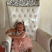 Kheina participe au concours pour gagner de l'argent avec cette photo : accessories, chair, child, clothing, dress, face, female, flower, flowerarrangement, flowerbouquet, furniture, girl, head, jewelry, person, photography, plant, portrait, sitting, throne