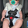 baby, car_seat, sunglasses, pacifier, infant, child, safety_harness, cute, foot, clothing, seat, strap, casual, indoor, portrait, person, young_child, fashion, accessory, relaxing