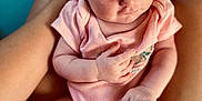Saona participe au concours pour gagner de l'argent avec cette photo : baby, infant, sleeping, pink_onesie, arms, legs, skin, person, closeup, peaceful, soft_light, indoor, portrait, human, newborn, cute, peace, resting, child, toddler