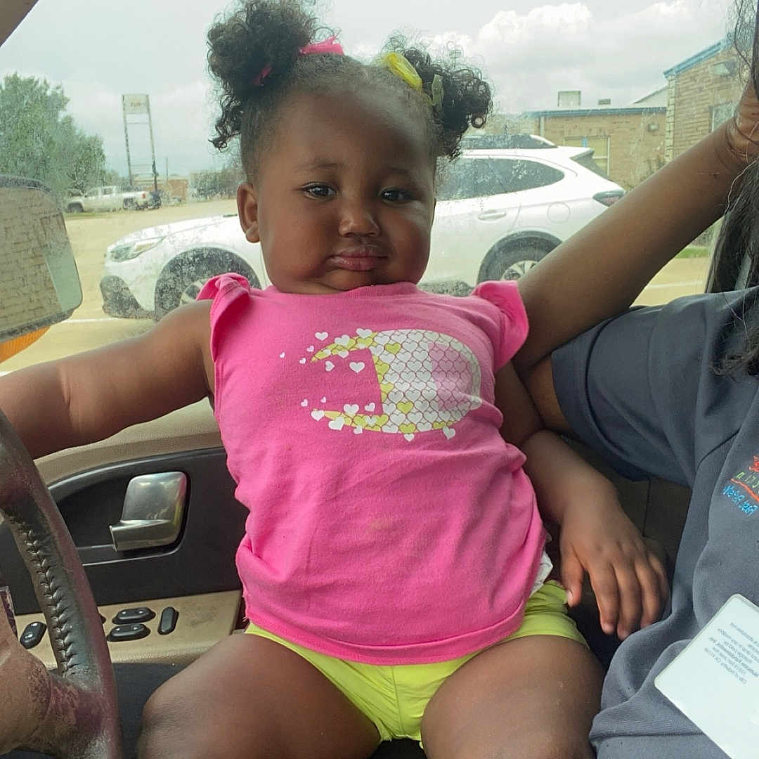 Yari joined the competition — help win amazing prizes! car, child, clothing, face, female, footwear, girl, head, machine, person, photography, portrait, shoe, shorts, sitting, summer, t_shirt, transportation, vehicle, wheel