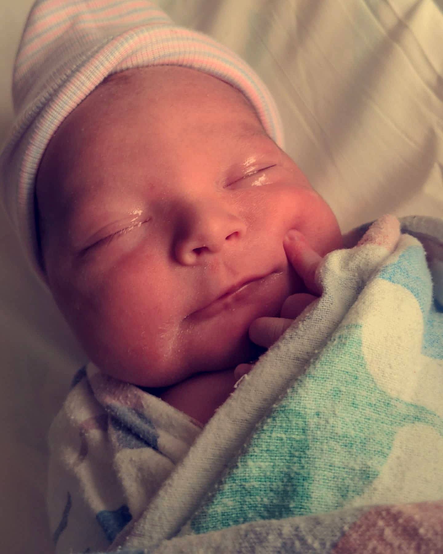 Monroe is registered to the contest to win money with this photo: baby, baby_sleeping, cheek, chin, comfort, eye, eyebrow, face, forehead, happy, head, headgear, iris, lip, mouth, nose, person, skin, smile, textile