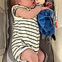 arm, baby, bassinet, child, comfort, cute, face, foot, hand, indoors, infant, mickey_mouse, nap, peaceful, plush_toy, resting, sleeping, soft_toy, striped_clothing, toy
