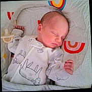Journey joined the competition — help win amazing prizes! newborn, baby, sleeping, infant, onesie, sheep_pattern, baby_nest, pacifier, cozy, soft, cute, peaceful, child, sleep, bed, blanket, colorful, rainbow, hand, portrait