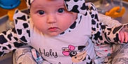 Journey joined the competition — help win amazing prizes! activity_center, baby, child, clothing, colorful, cow_print, cushion, cute, expression, eyes, face, headband, indoor, infant, looking, playtime, portrait, seat, soft_lighting, toy