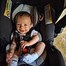 Wesley joined the competition — help win amazing prizes! baby, car_seat, smiling, infant, child, toy, socks, seatbelt, indoor, happy, person, cute, clothing, head, face, young_child, sitting, baby_toys, infant_care, child_safety