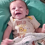 Wesley joined the competition — help win amazing prizes! baby, smiling, cushion, blanket, bed, pillow, clothing, infant, indoor, person, happy, cute, fabric, pattern, head, small_child, portrait, resting, comfort, cozy