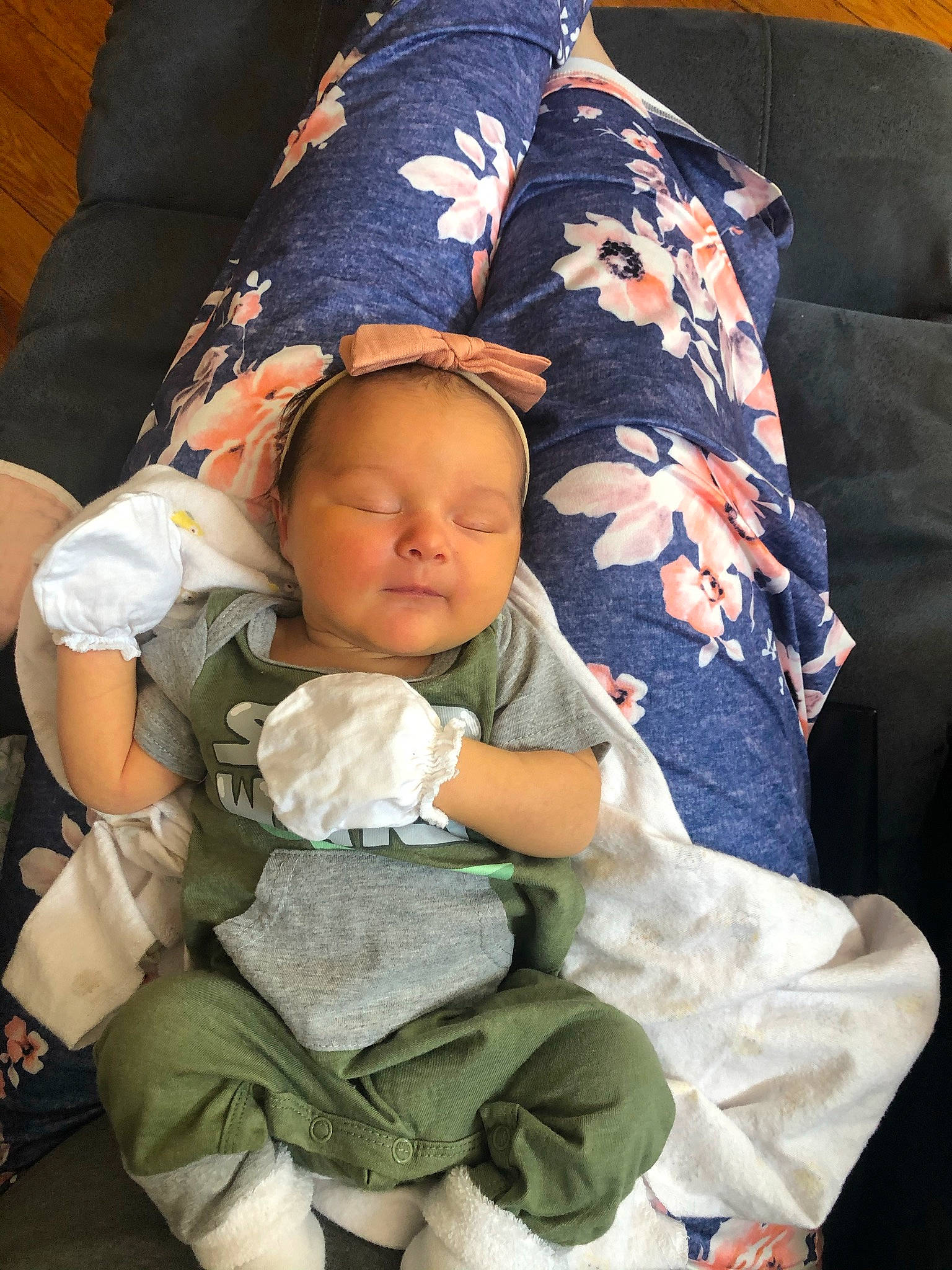 Lilly is registered to the contest to win money with this photo: baby, baby_products, baby_sleeping, baby_toddler_clothing, cheek, child, comfort, facial_expression, finger, head, interaction, lap, linens, mouth, person, product, sitting, skin, sleeve, textile