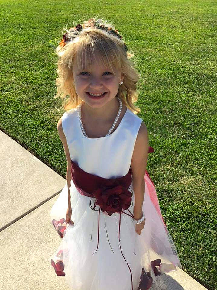 Lillian joined the competition — help win amazing prizes! ceremony, child, dress, grass, hair, hairstyle, joy, person, plant, smile, summer, toddler, wedding, wedding_ceremony_supply