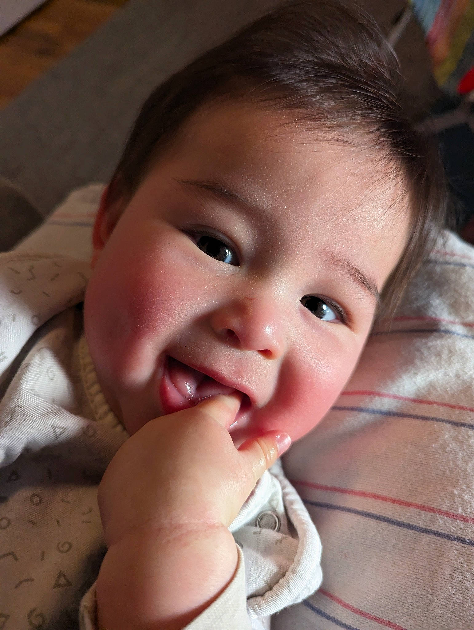 Tom is registered to the contest to win money with this photo: baby, beauty, cheek, chin, ear, eye, eyebrow, eyelash, face, gesture, happy, iris, lip, mouth, nose, person, skin, smile, thumb, toddler