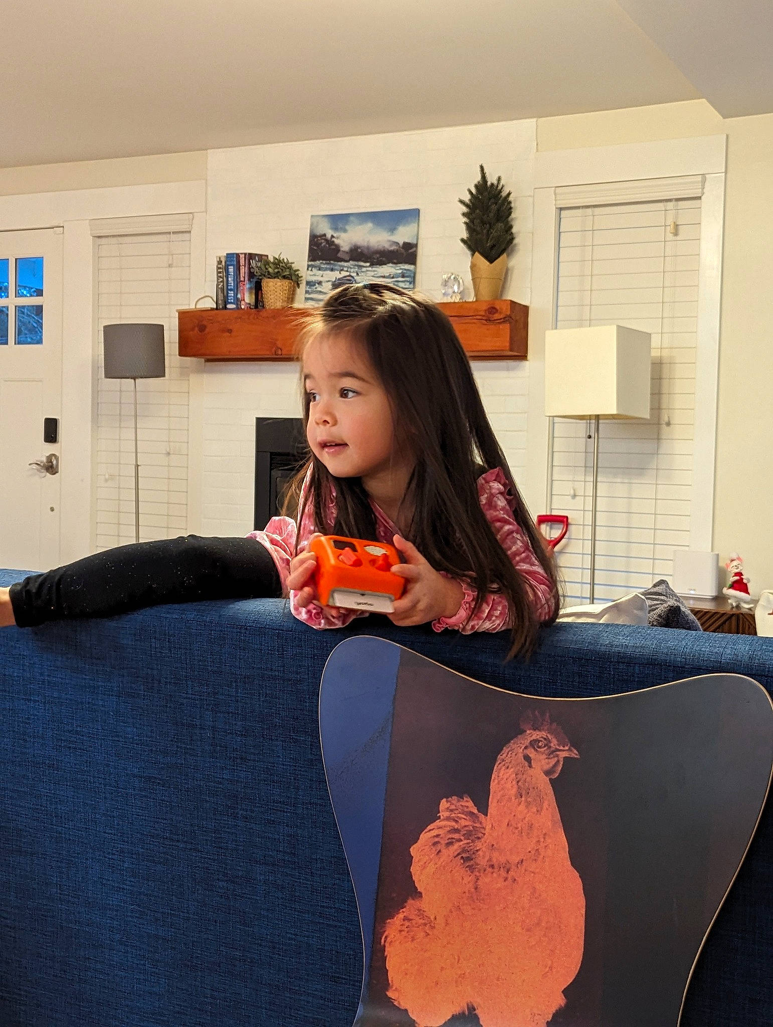 Lily joined the competition — help win amazing prizes! bag, comfort, couch, cucurbita, dress, floor, flooring, houseplant, human_leg, linens, luggage_and_bags, musical_instrument, orange, person, picture_frame, plant, pumpkin, room, sitting, toddler