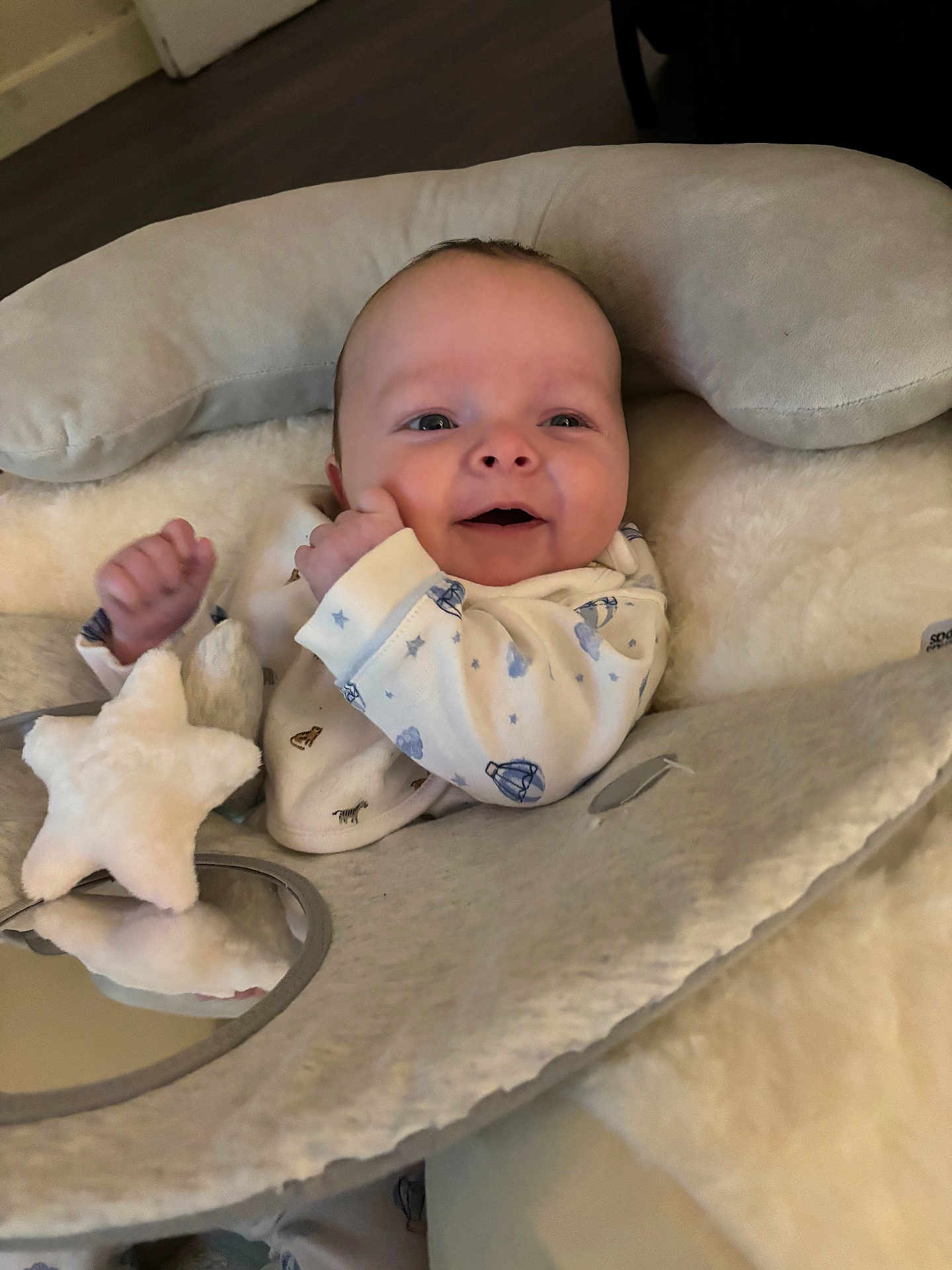 Luca-Bleu joined the competition — help win amazing prizes! baby, infant, smiling, plush_toy, star_toy, cushion, soft_texture, indoors, cozy, sleepwear, child, face, happy, cute, newborn, comfort, blanket, head_support, person, portrait