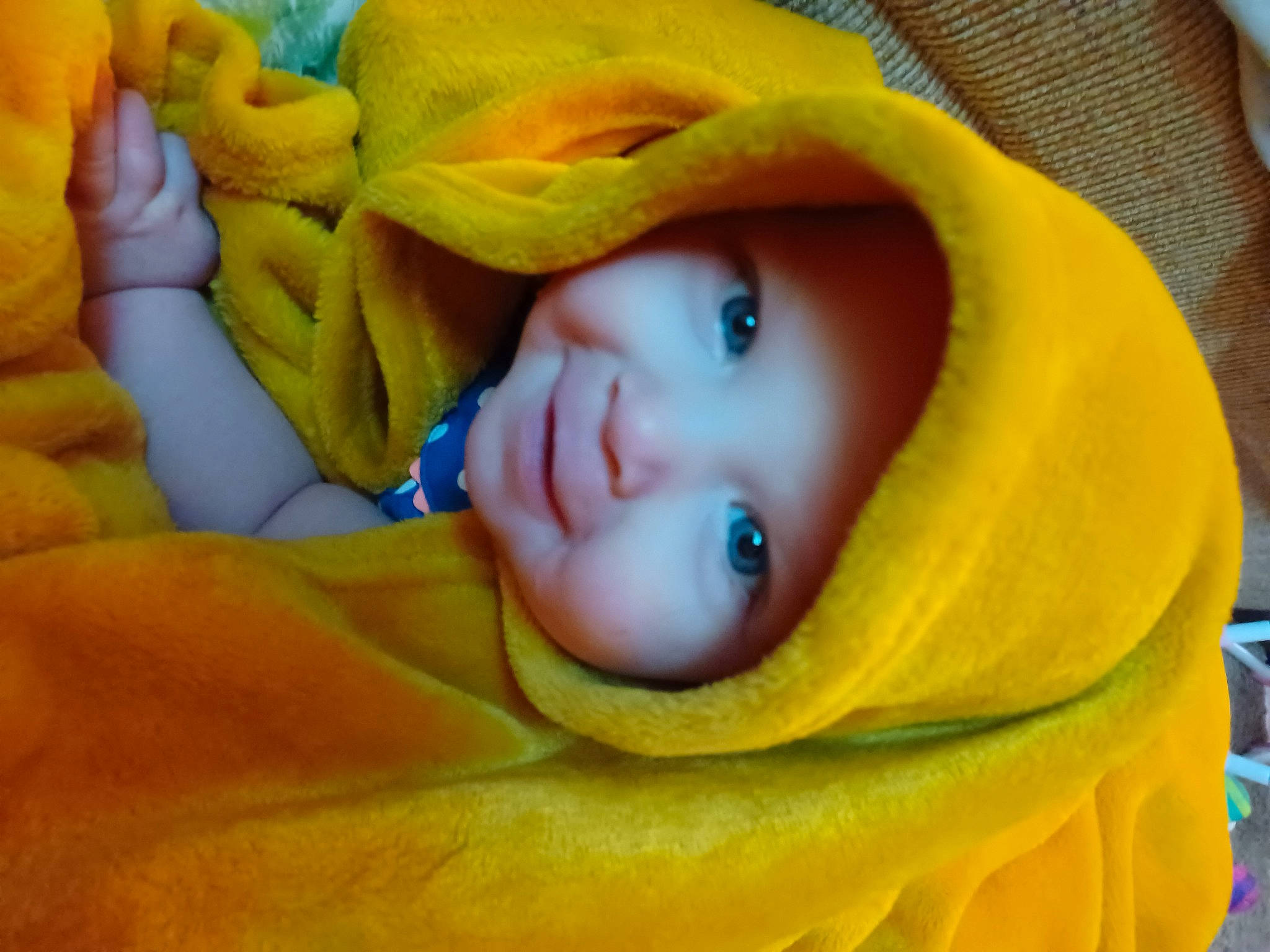 Edelweiss is registered to the contest to win money with this photo: baby, beauty, cheek, comfort, eye, eyebrow, eyelash, happy, head, headwear, human_body, iris, lip, nose, orange, person, skin, smile, textile, toddler