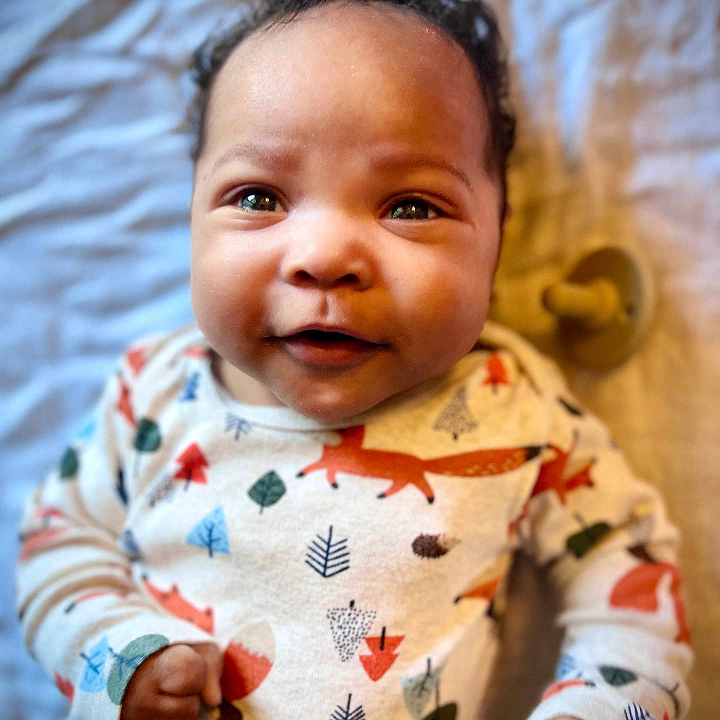 Cameo is registered to the contest to win money with this photo: applique, baby, babylaughing, bodypart, clothing, face, finger, fist, hand, happy, head, laughing, newborn, pajamas, person, photography, portrait, quilt, smile, wrist