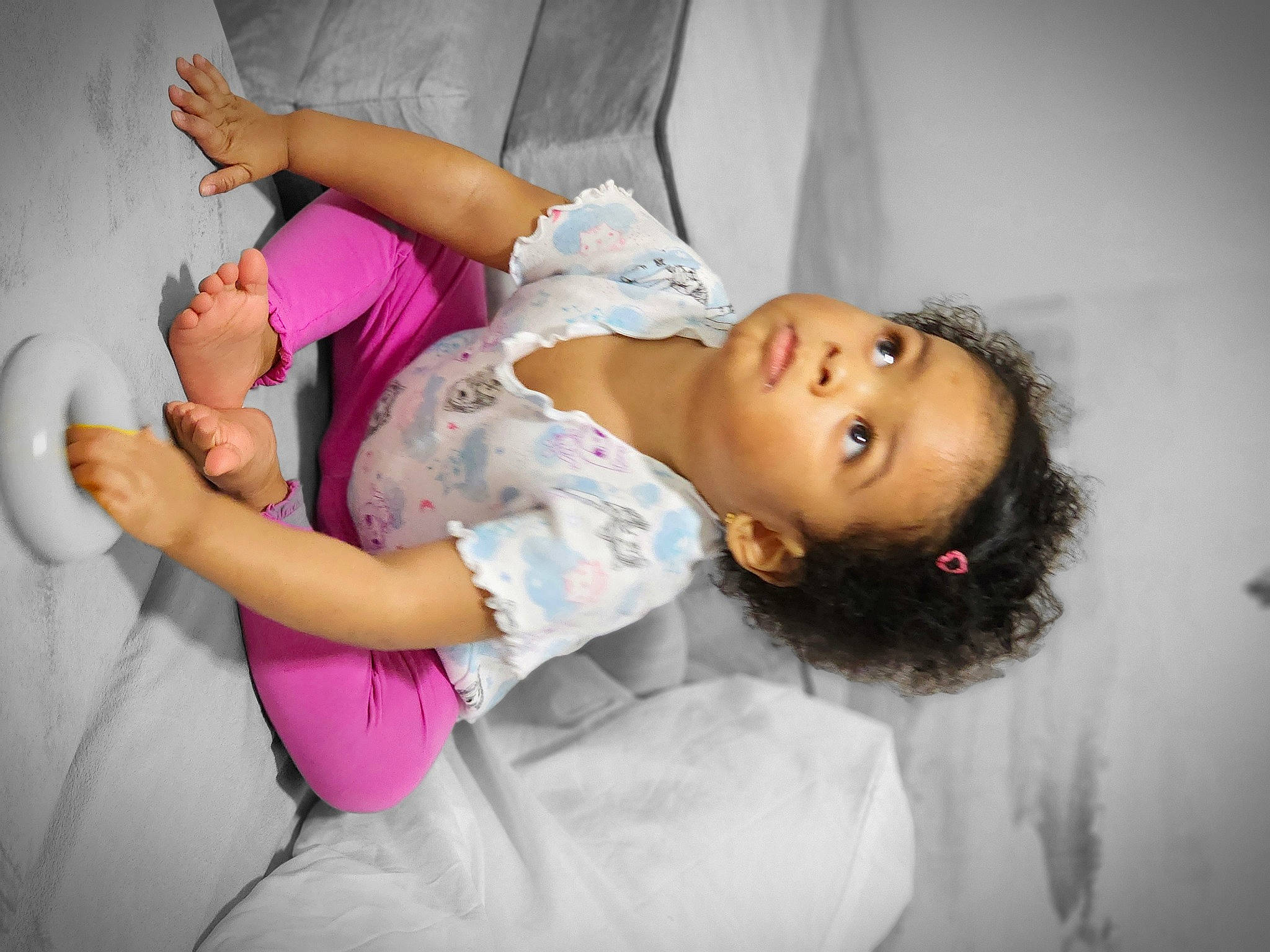 Lilyana is registered to the contest to win money with this photo: abdomen, baby, child, comfort, elbow, eyelash, flash_photography, fun, happy, human_leg, knee, leisure, magenta, mouth, person, pink, room, sitting, skin, thigh