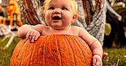 Izabella joined the competition — help win amazing prizes! baby, child, pumpkin, halloween, autumn, outdoor, portrait, smiling, happy, sitting, skeleton, statue, garden, grass, orange, costume, infant, face, seasonal, photography