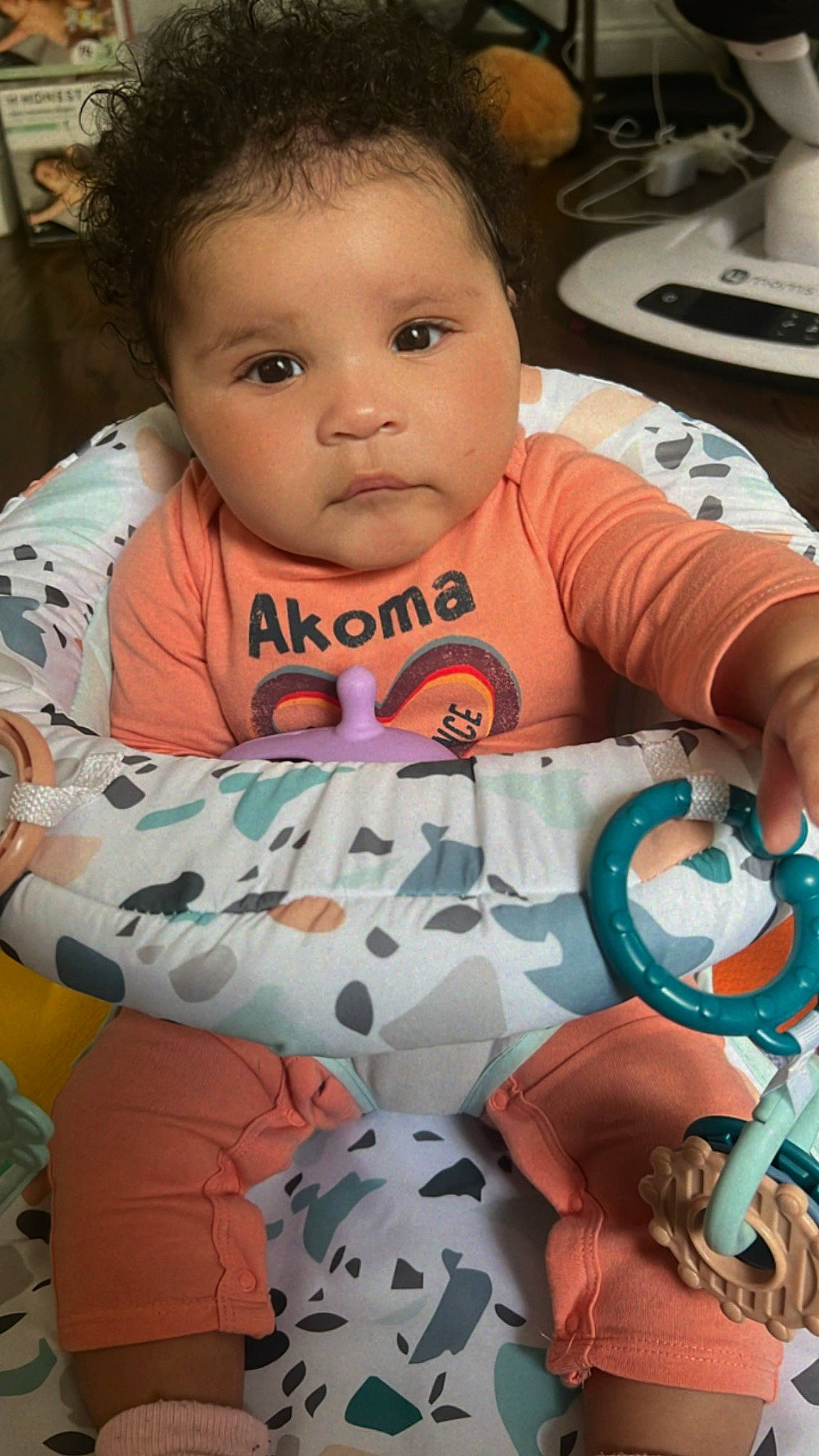 Jazelle is registered to the contest to win money with this photo: baby, baby_products, baby_toddler_clothing, cheek, child, comfort, cool, eyelash, facial_expression, fun, happy, linens, mouth, pattern, person, play, sitting, skin, sleeve, textile