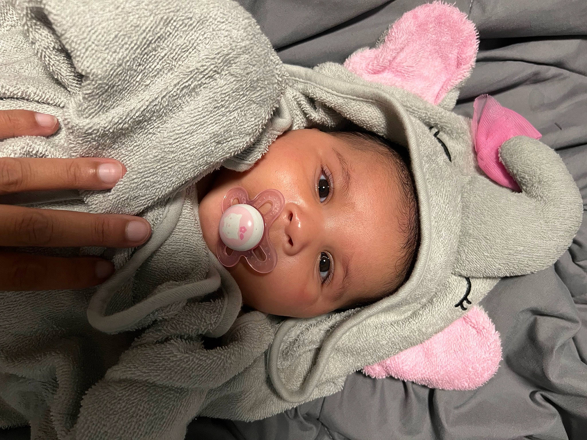 Jazelle joined the competition — help win amazing prizes! baby, cheek, chin, comfort, eye, eyebrow, face, facial_expression, finger, gesture, headgear, lip, mouth, nose, outerwear, person, skin, sleeve, textile, toddler