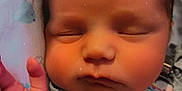 Autumn Rose is registered to the contest to win money with this photo: baby, newborn, sleeping, hand, face, cheeks, blanket, pattern, whale, colorful, strap, rainbow, flower, clothing, skin, peaceful, cute, infant, portrait, closeup