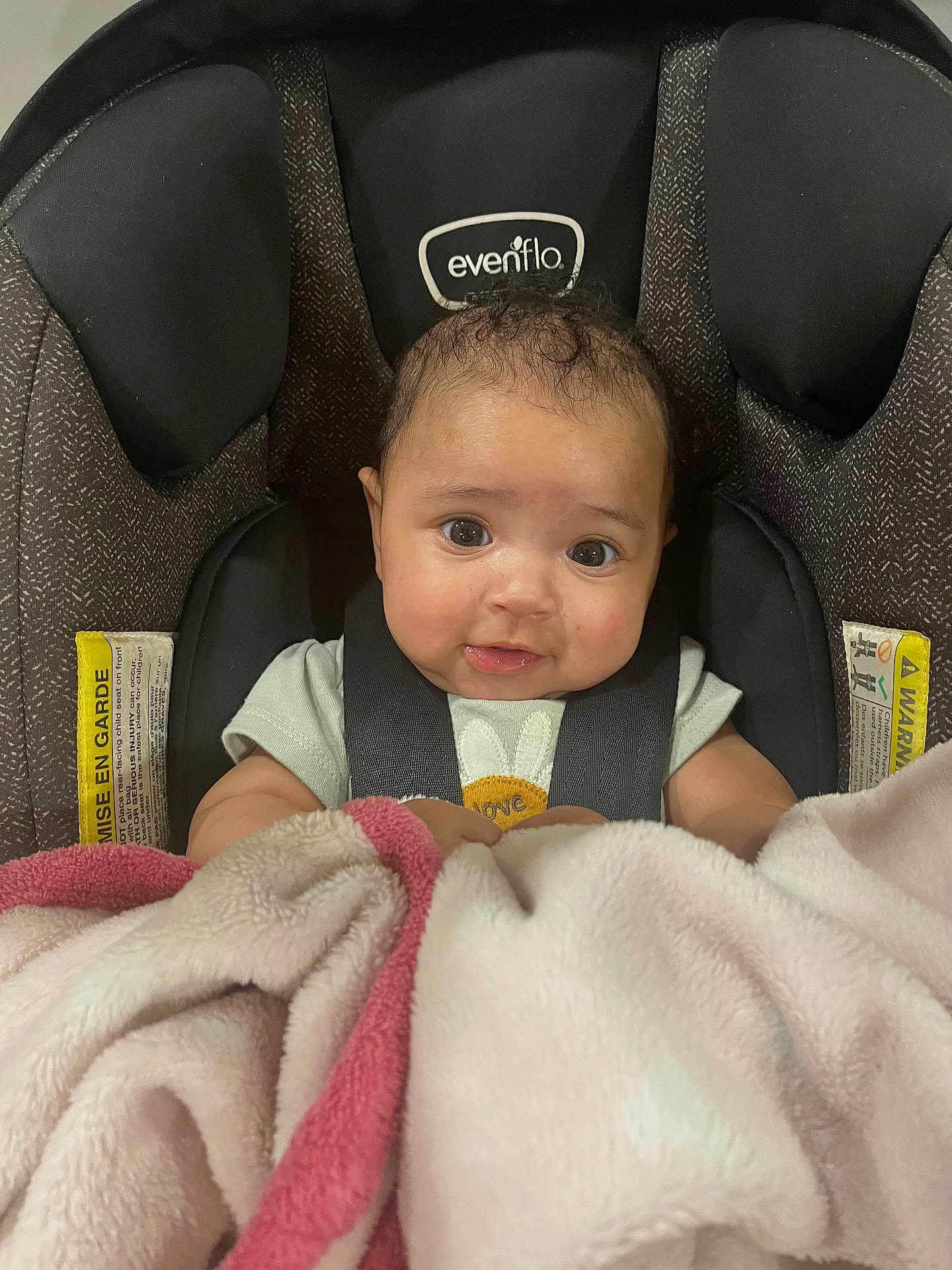 Selena joined the competition — help win amazing prizes! baby, car_seat, blanket, child, infant, cute, straps, soft, pink, white, looking, eyes, face, clothing, indoors, seat, comfort, young, adorable, expression