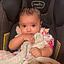 baby, infant, car_seat, blanket, soft_toy, child, cute, indoors, person, clothing, comfort, holding, face, skin, hair, eyes, seat, pink, warm, toddler