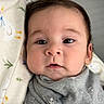 anchor_pattern, baby, baby_bib, blanket, child, closeup, clothing, cozy, cute, expression, eyes, face, grey_outfit, indoors, infant, newborn, peaceful, portrait, resting, soft_texture