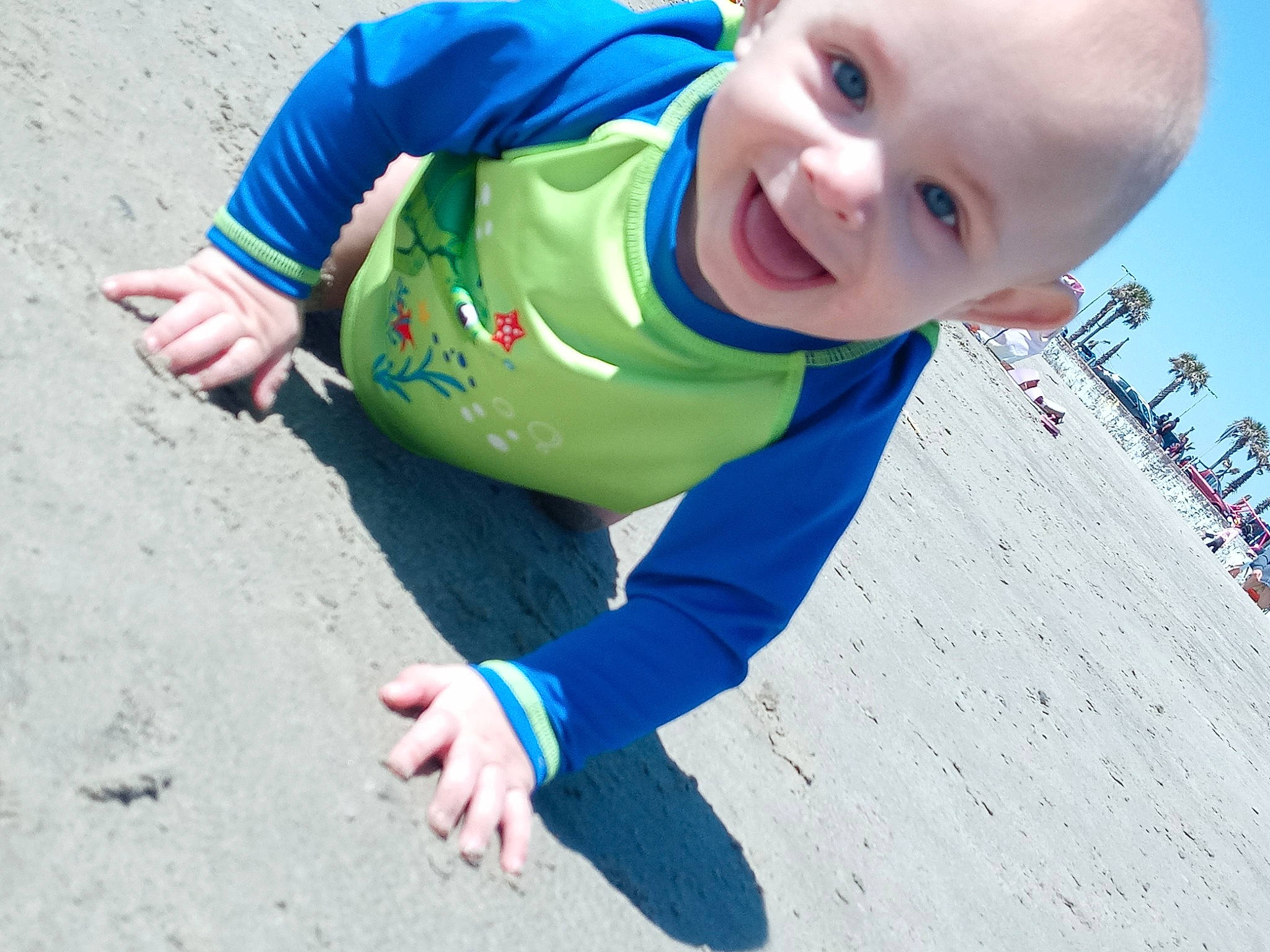 Pentomino is registered to the contest to win money with this photo: azure, baby, baby_toddler_clothing, child, facial_expression, fun, grass, hairstyle, happy, head, leisure, people_in_nature, person, photograph, recreation, skin, sky, sleeve, smile, summer