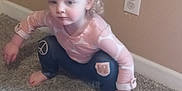 Alyvia is registered to the contest to win money with this photo: baby, babycrawling, barefoot, blonde, bodypart, clothing, crawling, face, finger, hair, hand, head, indoors, jeans, pants, person, photography, portrait, sitting, toe