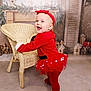 Brooklyn joined the competition — help win amazing prizes! baby, child, red_clothing, tutu, headband, wicker_chair, smiling, standing, indoor, holiday_decor, wooden_houses, greenery, floor, sock, cute, festive, portrait, person, happy, cozy