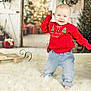 baby, blond_hair, blue_eyes, celebration, child, christmas_tree, cute, decorations, festive, happy, holiday, indoor, jeans, portrait, red_sweater, rug, seasonal, smiling, standing, wreath