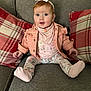 Amelia is registered to the contest to win money with this photo: accessories, baby, blanket, blonde, clothing, coat, couch, crawling, cushion, doll, face, furniture, hair, hat, head, homedecor, hosiery, indoors, interiordesign, jacket