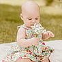 baby, child, flower, floral_dress, outdoor, grass, blanket, sitting, cute, infant, nature, soft_light, summer, portrait, hands, feet, greenery, peaceful, daylight, baby_dress